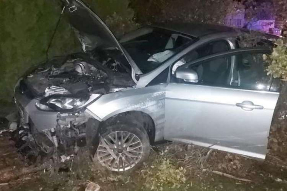 The damaged vehicle on Marshlands Road, Neston - Picture: Cheshire Fire and Rescue