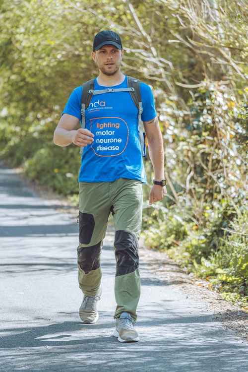 Alex pictured during his 100-mile non-stop walk from Bournemouth to Seaton