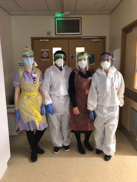 Staff at the Royal Stoke University Hospital wearing PPE made by Eaton Bank Academy.