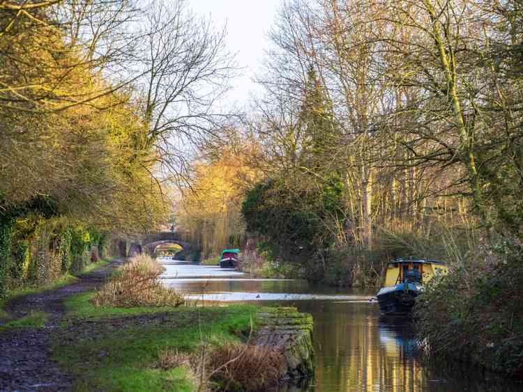 Canal boat reflects Macclesfield canal Congleton