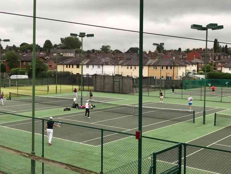 Players in action at the tennis club