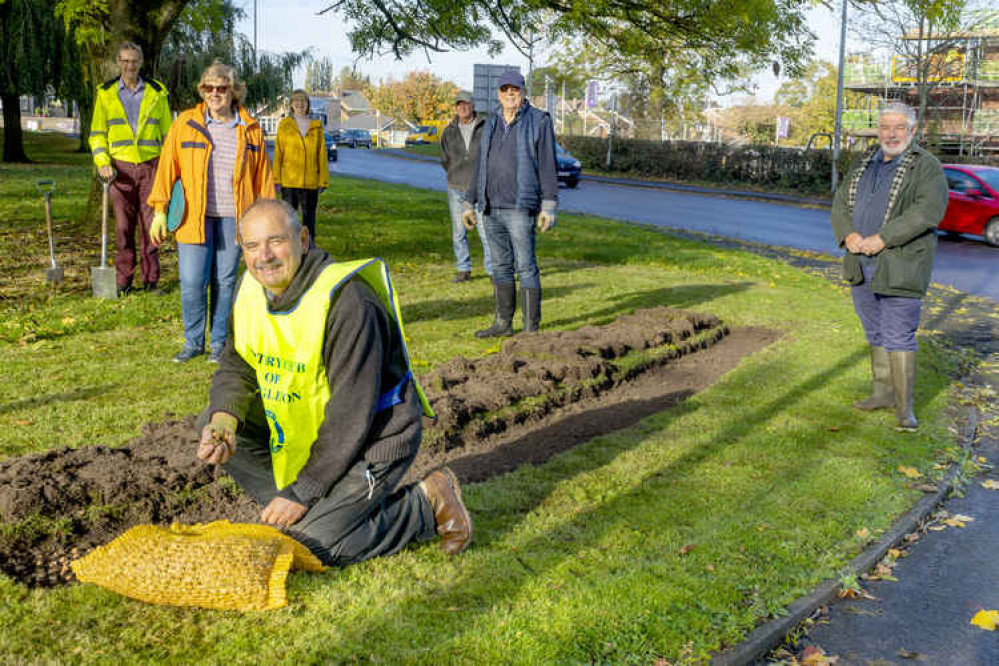 Rotarian Ian Robinson (front) leads the campaign in Congleton. Other Rotarians assisted with the planting.