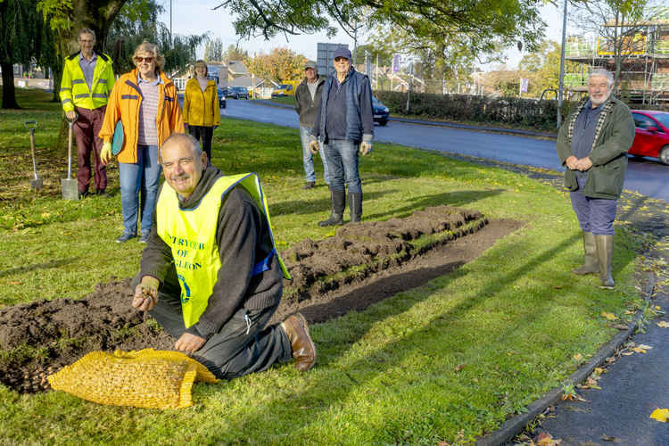 Rotarian Ian Robinson (front) leads the campaign in Congleton. Other Rotarians assisted with the planting.