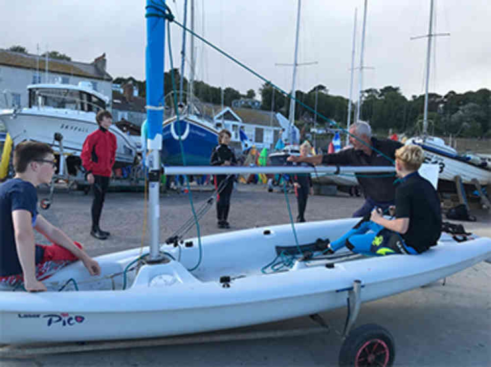 Youngsters learning to sail on dry land because the winds in Lyme Bay were too high