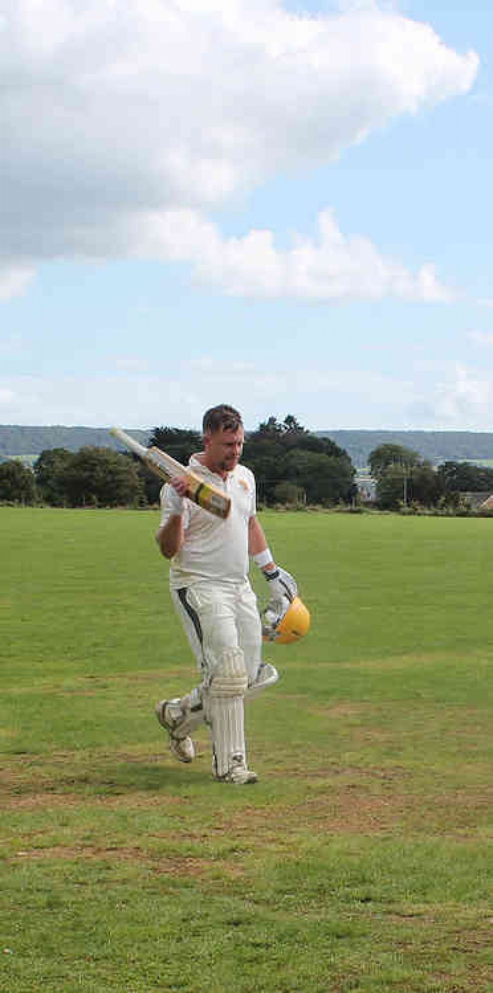 Uplyme skipper Steve Batey acknowledges the crowd after scoring another century in Devon Mini-League semi-final at Feniton