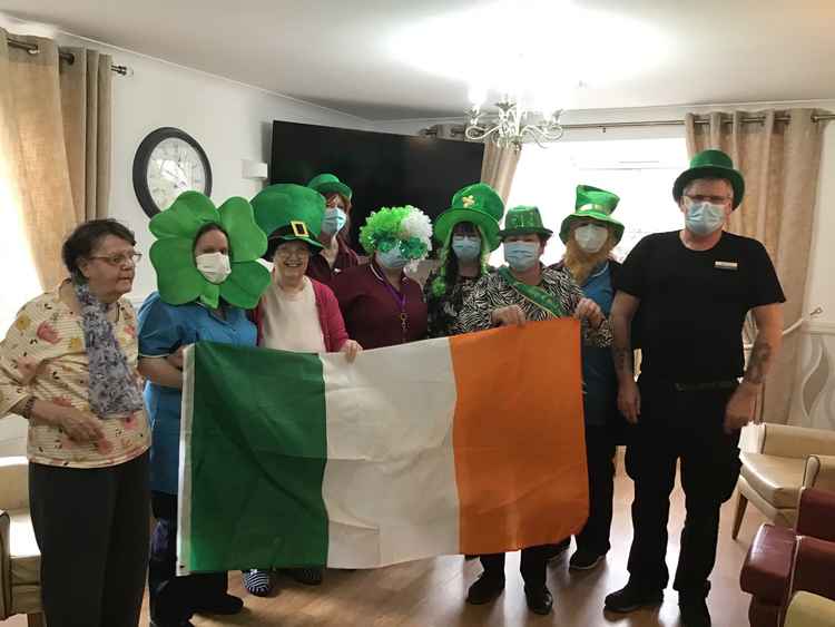 Staff and residents celebrating St Patrick's Day.