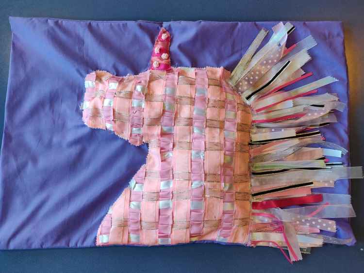 Year 10 Isabelle J's pink and purple unicorn pillow case won her the first prize in the CHS  Berisfords Design Award Competition.