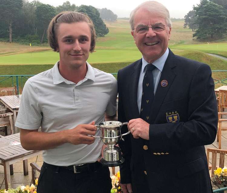 A winner again . . . Sam with the Cheshire Boys trophy presented by county president David Durling at Delamere Forest.