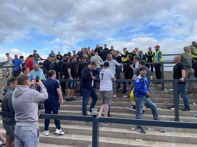 Macclesfield's staff helped calm fans after the disorder, which has led to seven arrests. (Image - Andy Fleming / @flem79)