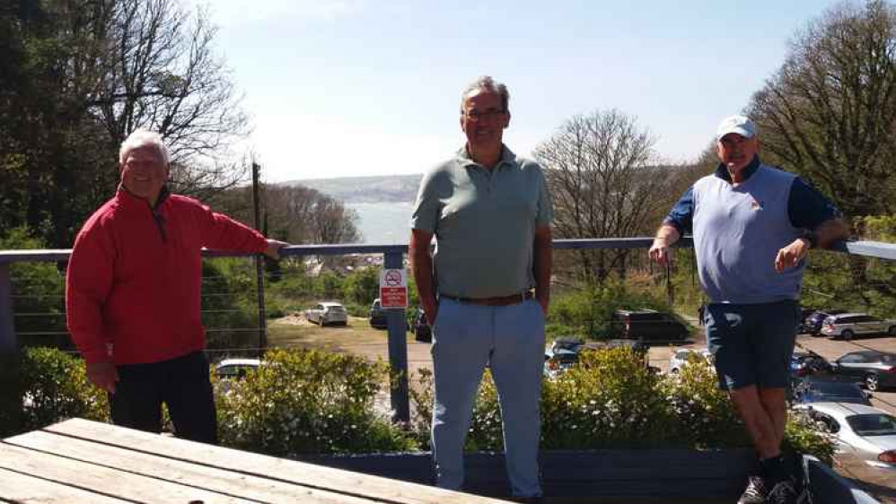 The picture shows a proud Simon Wellington on the left treating his team to well deserved drinks on the club's balcony overlooking Seaton Bay - Andy Hopgood in the middle and Kyle Phillpotstaking everything in his stride.