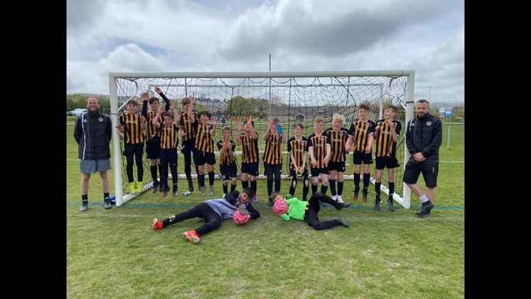 Axminster Town Under 12s celebrate winning a place in the final of the High Holborne Cup