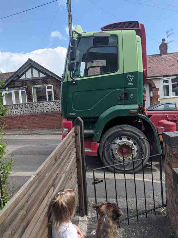 A HGV passing a residents home on Withyfold Drive.