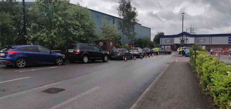 Staff members directed traffic into organised queues.