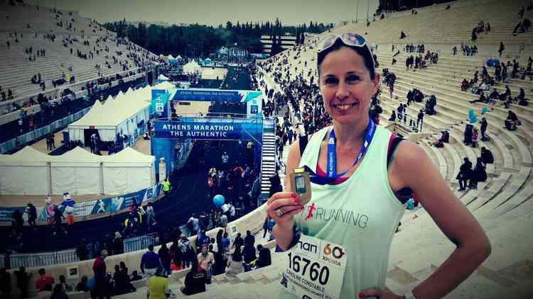 Caroline with her medal after she completed the Athens Marathon in November 2018