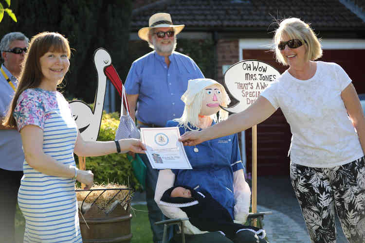 Dilys Griffith's receiving her certificate.