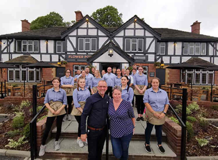 The team at the Flower Pot featuring General Manager Glenn Farrell and wife Sam