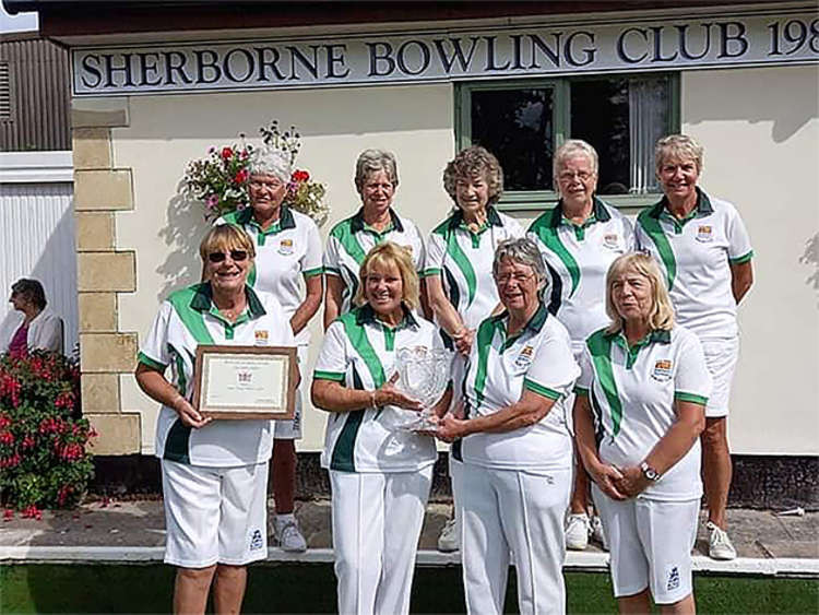 The Lyme Ladies pictured wit their trophy Ann Allman, Lesley Broom, Nicky Driscoll, Mary Haseman, Chris Pomeroy, Angela Rattenbury, Sue Rowe, Erica Sarson and Pam Weech.