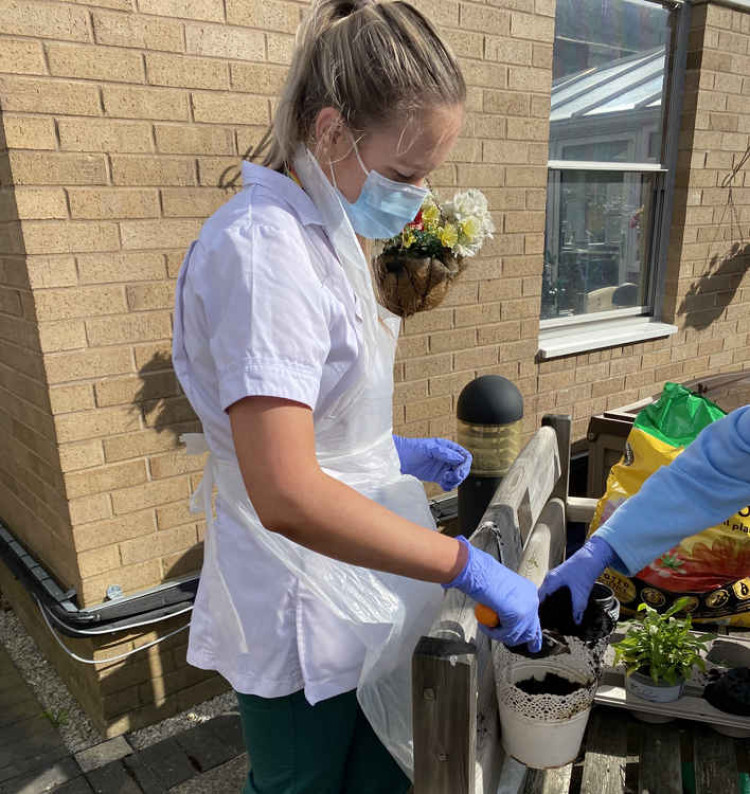 This young woman encouraged gardening for dementia patients during her Macclesfield work placement, and has been praised for her idea. (Image - (Image Credit - East Cheshire NHS Trust)