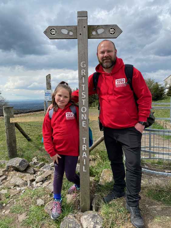 Tess and Owen Liddle will hike 36 miles through the Macclesfield countryside from June 3. They are pictured wearing hoodies for Ollie and Amelia's cause. (Image - Tess Liddle)