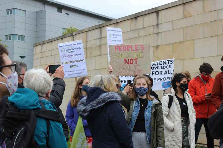 Protestors chanted "No profit, no patent, give the people vaccinations". All wore masks and kept a safe social distance.