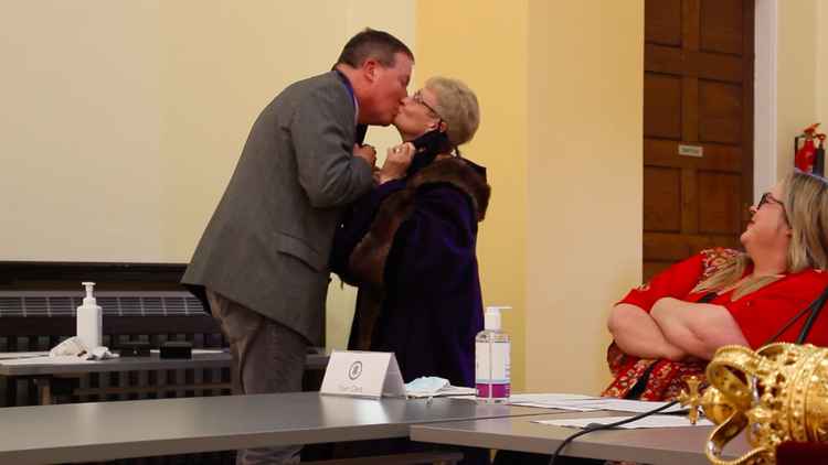 Brian and Fiona share a kiss. Partners for the Mayor and Deputy Mayor were awarded with medals.