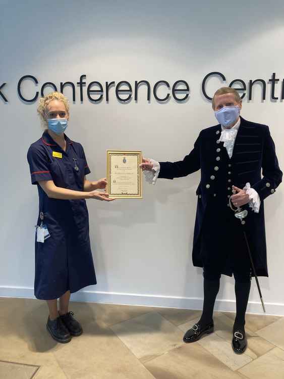 The High Sheriff awards Sarah Brocklehurst for her efforts in getting the Macclesfield area vaccinated. (Image - East Cheshire NHS Trust)