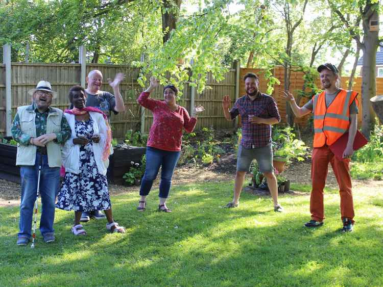 Cllr Alift Harewood-Jones MBE (second left) sought approval for the green space two months ago, and now it is completed, and her community couldn't be happier. Cllr Neil Puttick (right) was also at the garden launch, filming for Barnaby Bright.