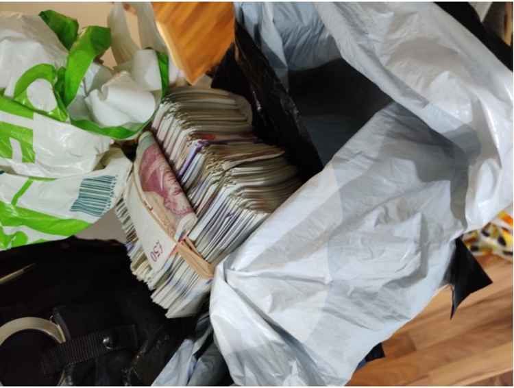 £19,470 cash recovered from Zakarai Ahmeds bedroom when Cheshire Police conducted a warrant on 9th July 2020. (Image - Cheshire Constabulary)