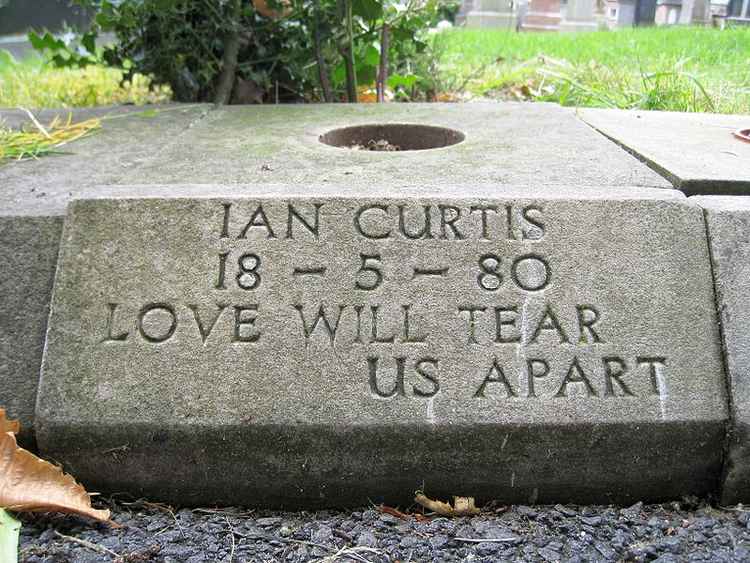 Singer-songwriter Ian Curtis was also a Civil Servant, he used to work for Macclesfield's Unemployment Office alongside his brief musical career. He has a headstone in Macclesfield Crematorium. (CC Unchanged Bernt Rostad https://bit.ly/2S545b3)