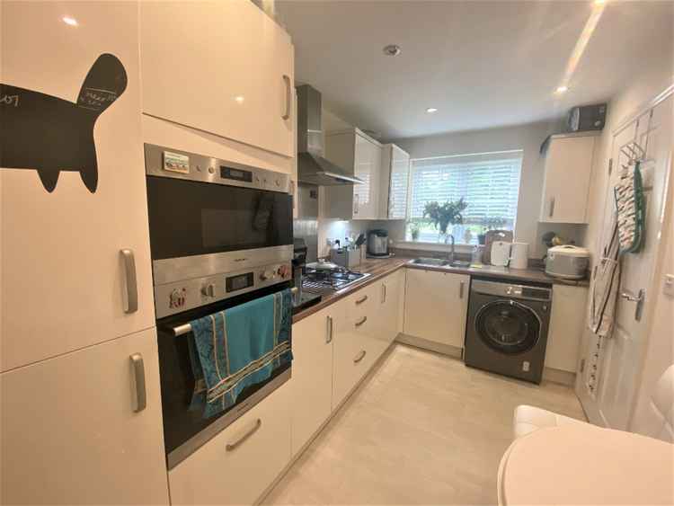 The kitchen is modern and bright for this Macclesfield rental home.