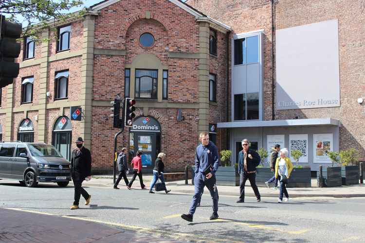 There are already signs of less masks around the face or chin outdoors in Macclesfield. You no longer legally have to wear them in pubs or shops as well.