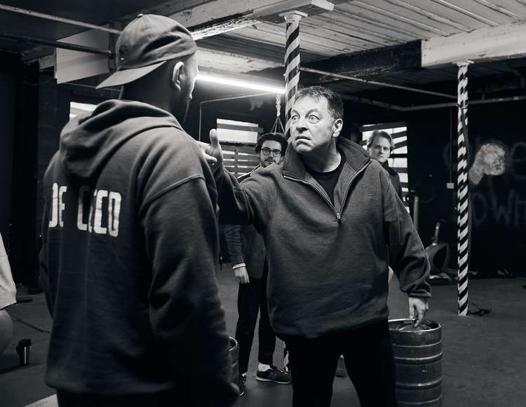 Cast members are pictured rehearsing the play in a Macclesfield gym.