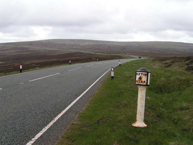 The high, narrow roads of Macclesfield's Cat and Fiddle will be a danger in the weather. This Grade II listed iron milepost reads "Buxton 4 miles, Macclesfield 7¾ miles. (Image - Dave Dunford / Milepost, A537 Cat and Fiddle Road / CC BY-SA 2.0)