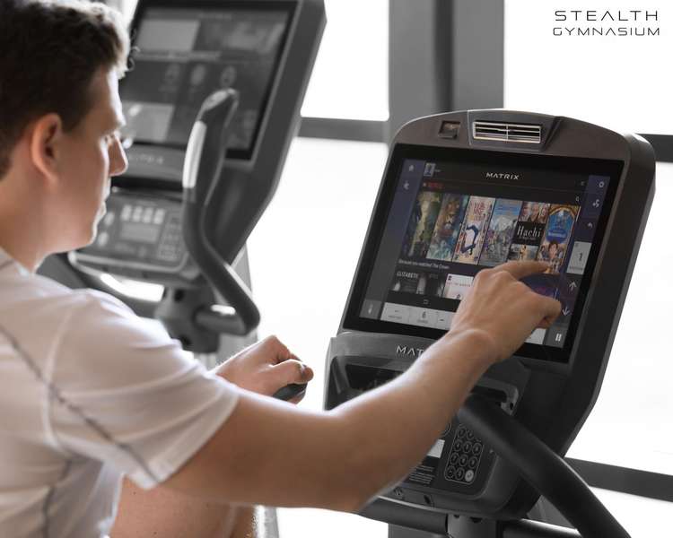 Netflix and drills? You can binge-watch while burning off those binge-eating calories on the exercise machines. (Image - Stealth Gymnasium)