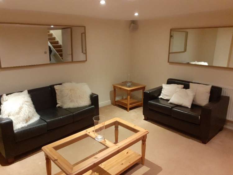 The £795 pcm property comes with these two comfy sofas. (Image - Belvoir Macclesfield)