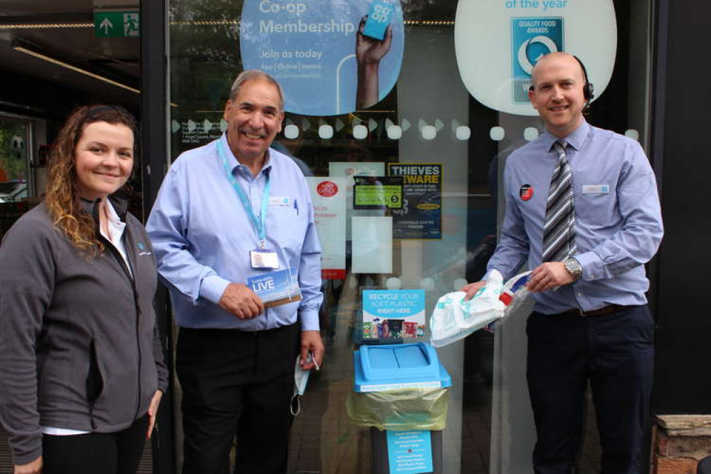 The outdoor unit is emptied daily. Posing with it are Prestbury's Member Pioneer Charlotte Percy, Member Pioneer Co-ordinator Martin Bates, and Co-op Prestbury Store Manager Paul McCormick.