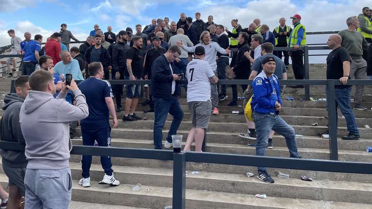 Rob's to the rescue: Macclesfield FC's Director of Football Robbie Savage, and owner Rob Smethurst helped calm fans at the high-tempered affair. (Image - Andy Fleming / @flem79)