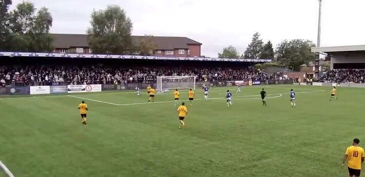 Former Hull City footballer James Berry-McNally slots home the winning strike, half an hour before fan clashes led to the game being postponed for ten minutes.