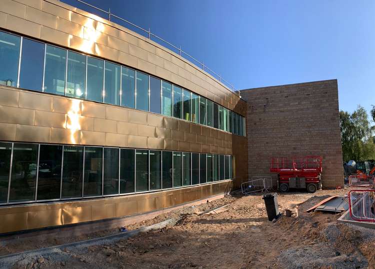 Macclesfield: The Victoria Road cancer centre will comprise part of - and have links to - Macclesfield District General Hospital. The external cladding is coming along nicely.