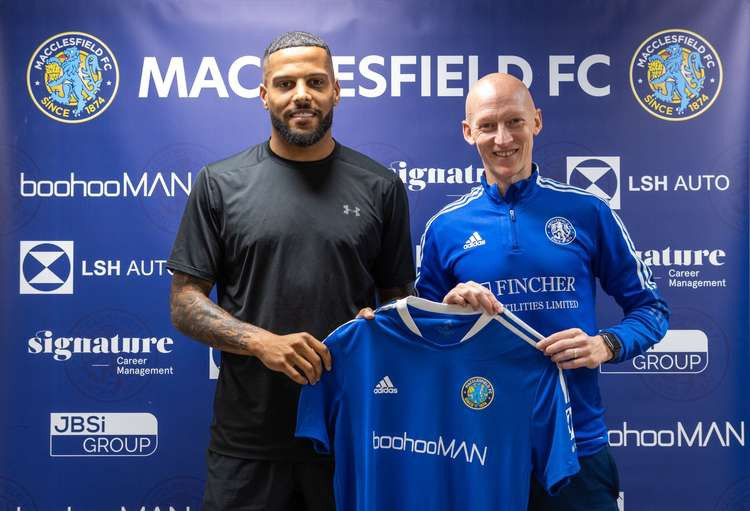 Macclesfield FC's new defender has played in Europe, and once made an appearance on the pitch at Wembley. Here he is pictured with Manager Danny Whitaker. (Image - Macclesfield FC)