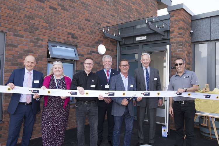 The ribbon is cut to open the new Proseal Wing at East Cheshire Hospice. From left, Steve Barnett (Construction Director at PE Jones Contracts), Karyn Johnston (East Cheshire  Hospice Chief Executive), Derek Barrett (Proseal Technical Director), Will Spin