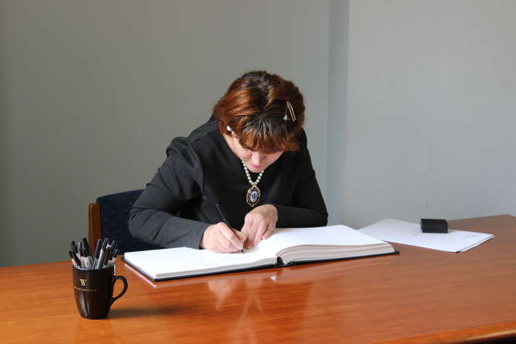 Macclesfield's Mayoress - who was born in Russia - signs her papers which make her a British citizen.