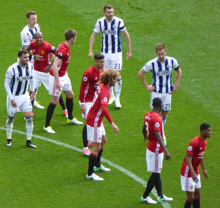 Evans (top left) defends a freekick for West Bromwich Albion in 2017 against his old club Manchester United. Evans left the Red Devils in 2015. (Image - CC 4.0 Ardfern bit.ly/3ABoJQF Cropped)