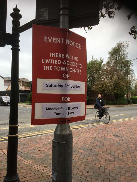 A Macclesfield cyclist and a Bikeathon sign on Chestergate this week.