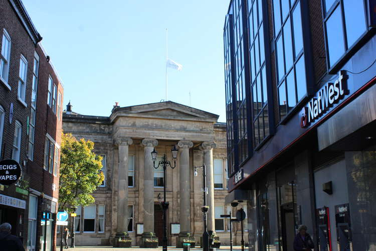 The Macclesfield flag flies low atop the Grade II* listed building.