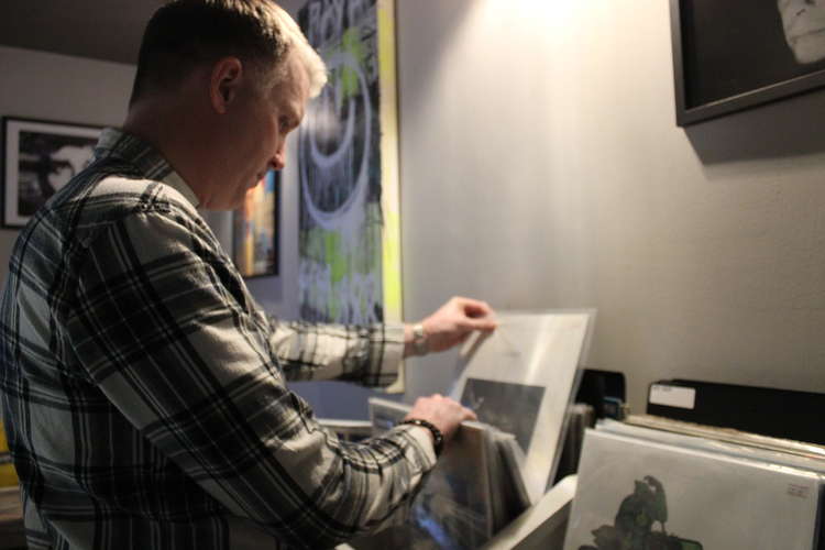 Macclesfield resident James King co-envisioned his dream business through lockdown, when he started buying more vinyl than ever. Pictured: The Proper Sound Co-Founder James rifles through some rare Joy Division LPs.