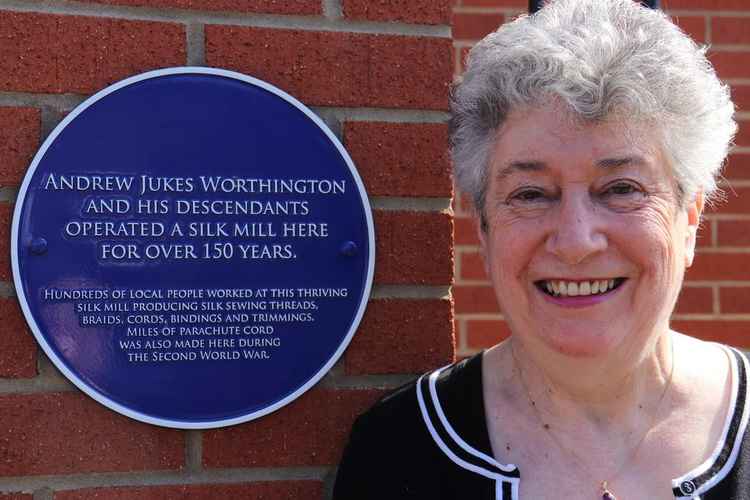 Cathryn Walton outside Portland Grange with the plaque