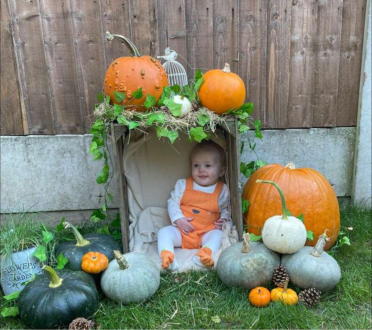 Baby Dolly Abbotts poses for a photograph in her Haslington garden