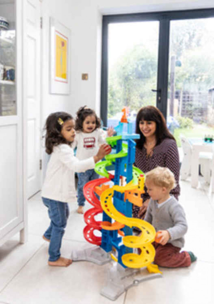 Bajaj's daughters and a friend playing with one of the toys. Photo Credit: John Sturrock