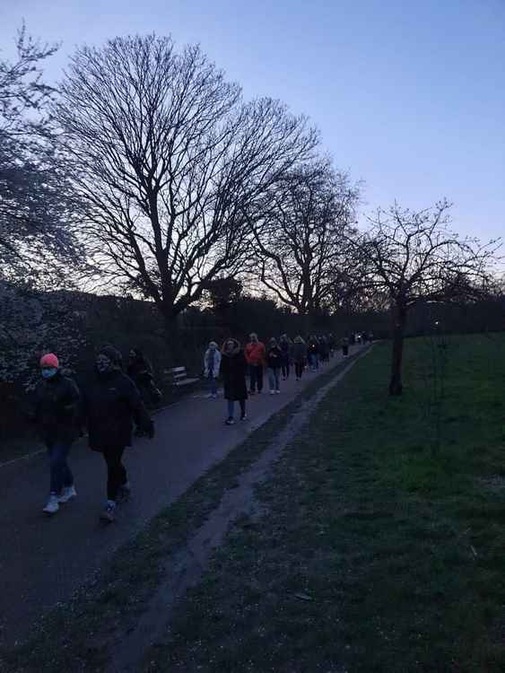 Around 200 people joined in on the walk, including men and young boys